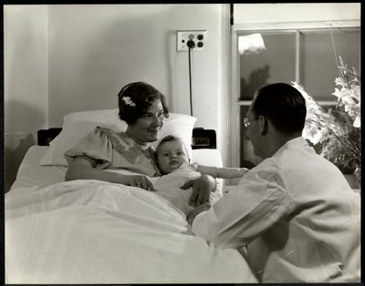 A mother and child in a hospital bed, New York, c.1937 by Byron Company